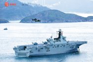PLN LHD-31 Hainan at Hong Kong + 2x Z-10A.jpg
