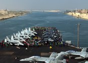 US_Navy_060529-N-7090S-026_Crew_members_gather_on_the_bow_for_a_Foreign_Object_Damage_(FOD)_Wa...jpg