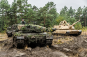 M1A2 Abrams MBTs alongside Polish Leopard IIA4 MBTs.png