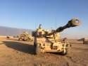 us army M109 Paladin howitzer and an MRAP at qayyarah airfield west Iraq Mosul Ops CJTFOIR.jpg