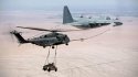 CH-53E Super Stallion sling loading a HUMVEE while aerial refueling from a KC-130T Hercules .jpg