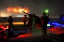 US Army M777A2 lights up the night sky .jpg