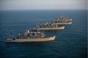 Four Avenger-class mine countermeasures ships steam in formation in the Arabian Gulf..jpg