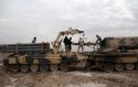 Iraqi soldiers load rockets into TOS1 .jpg