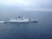 Nigerian Navy AW101 helicopter on the deck of PLAN 054A Frigate Yancheng 2.jpg