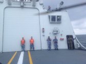 Nigerian Navy AW101 helicopter on the deck of PLAN 054A Frigate Yancheng 4.jpg